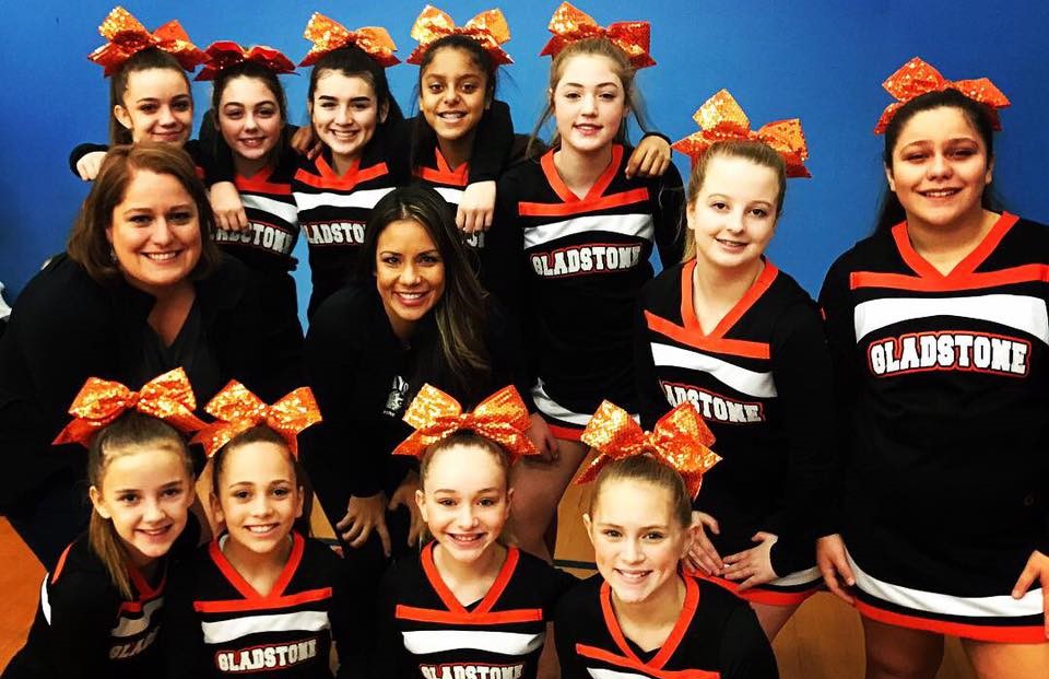 cheer team sitting on bleachers